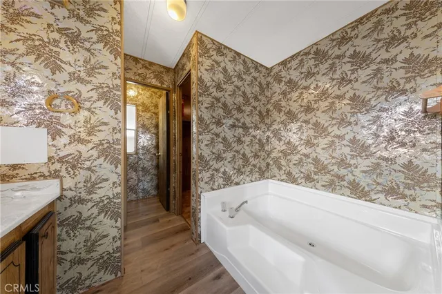 a bathroom with a bathtub and shower