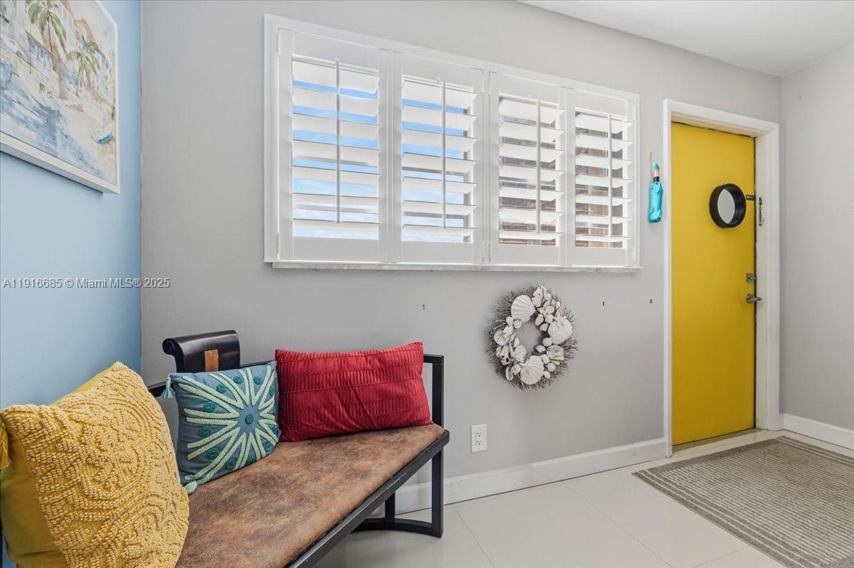 a living room with a couch and a window