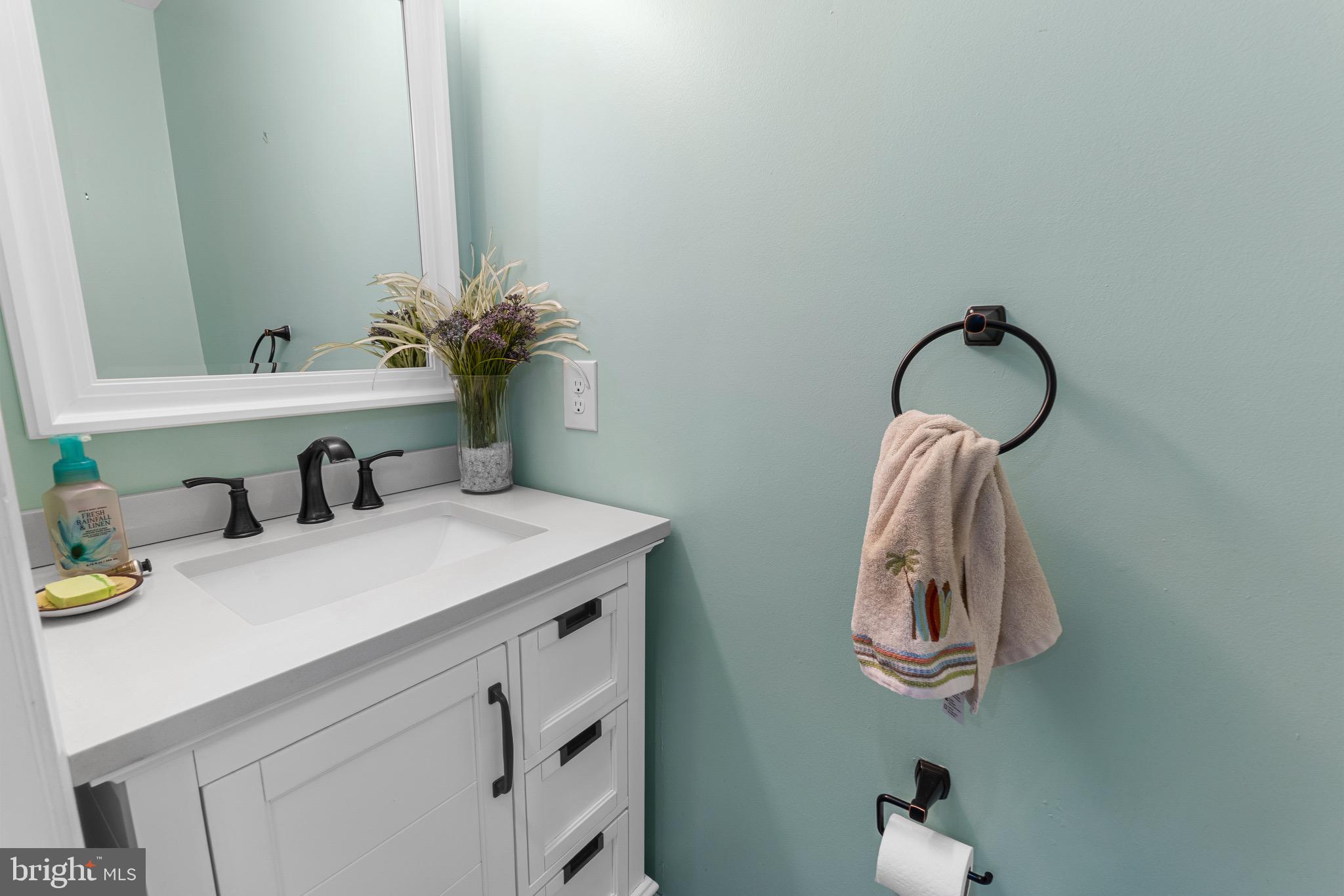 14010 Valleyfield Drive Silver Spring, MD 20906 - Photo 22 of 24 a bathroom with a sink vanity and a mirror