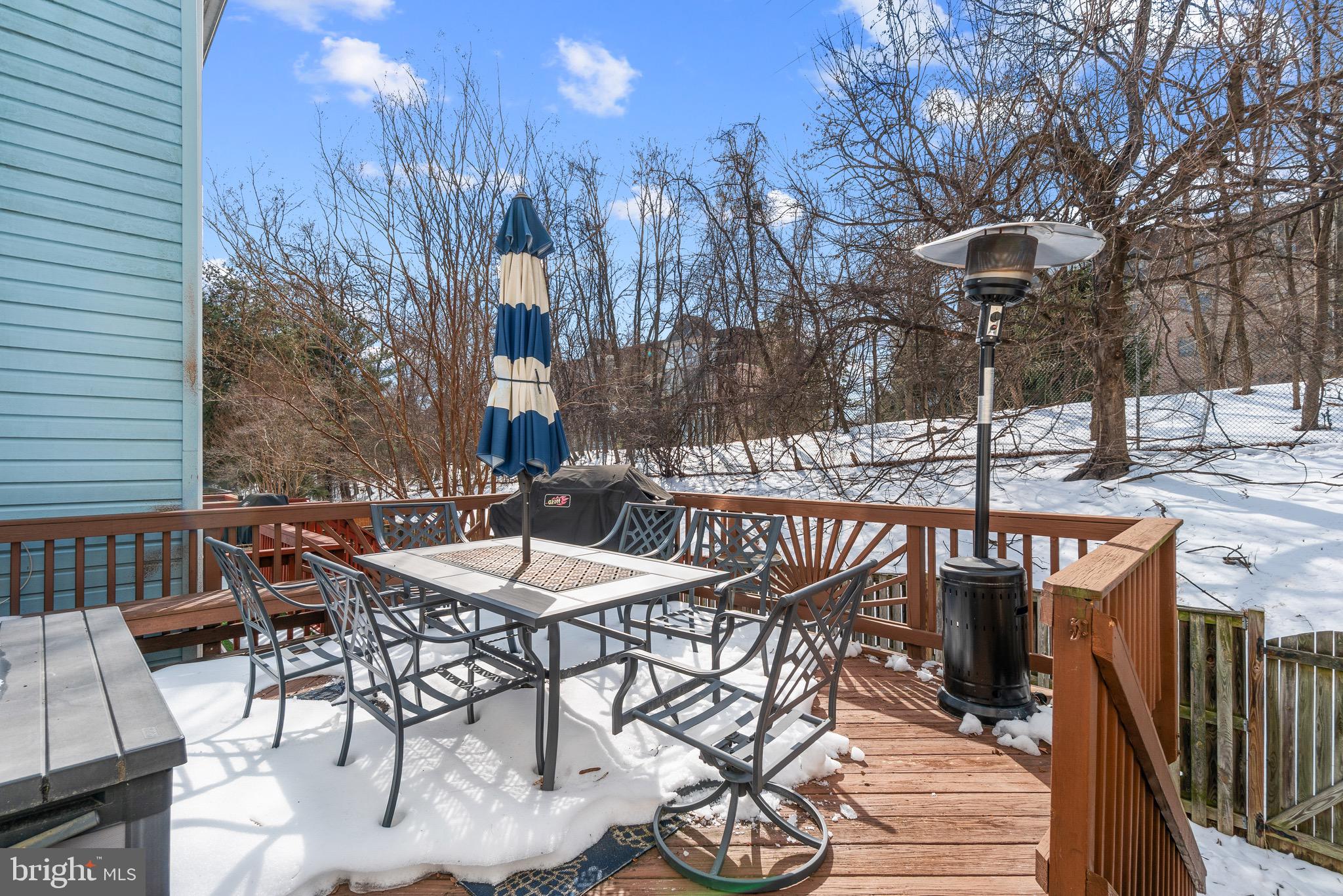 14010 Valleyfield Drive Silver Spring, MD 20906 - Photo 23 of 24 a view of a patio with table and chairs with wooden floor and fence
