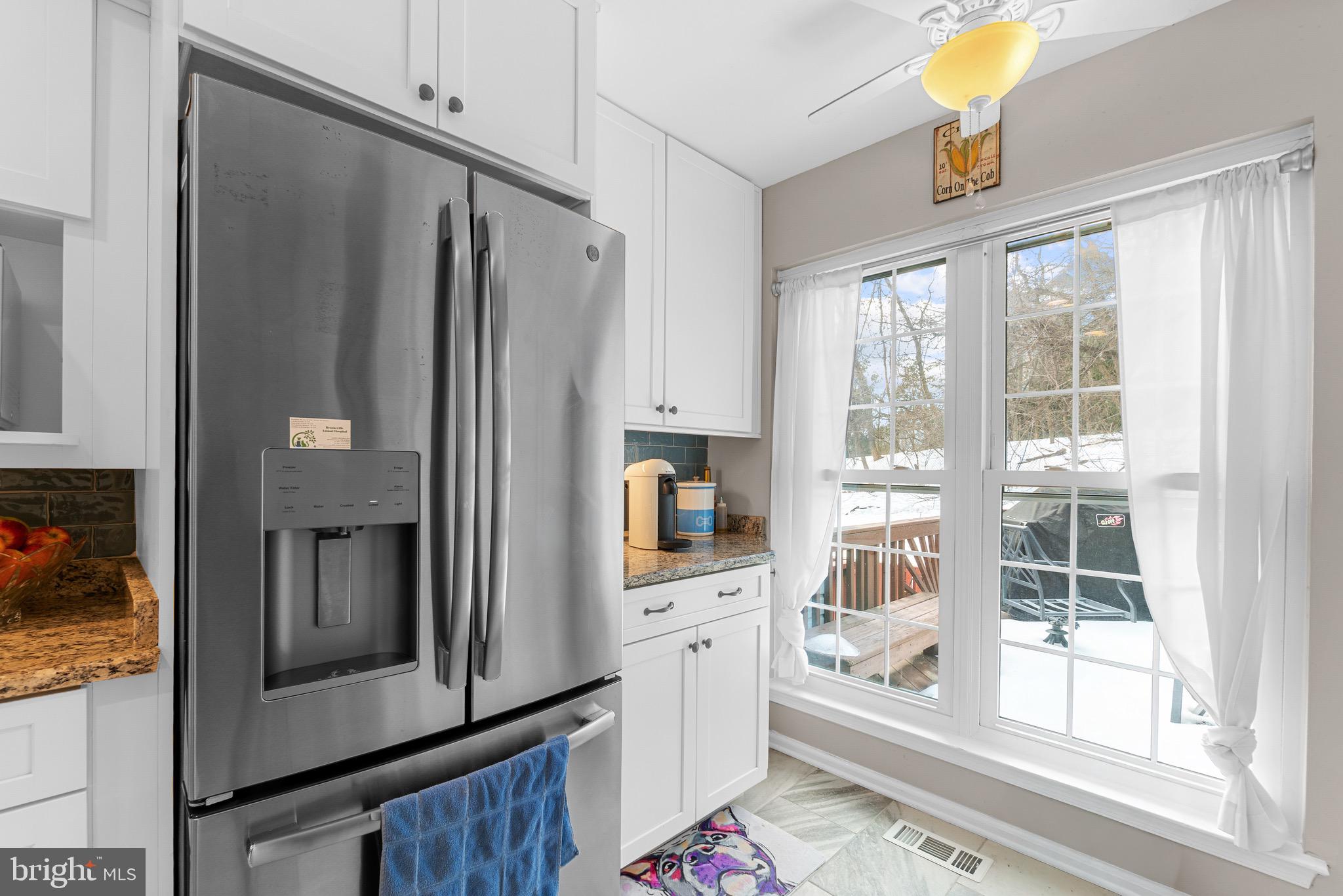 14010 Valleyfield Drive Silver Spring, MD 20906 - Photo 5 of 24 a kitchen with stainless steel appliances a refrigerator and a stove