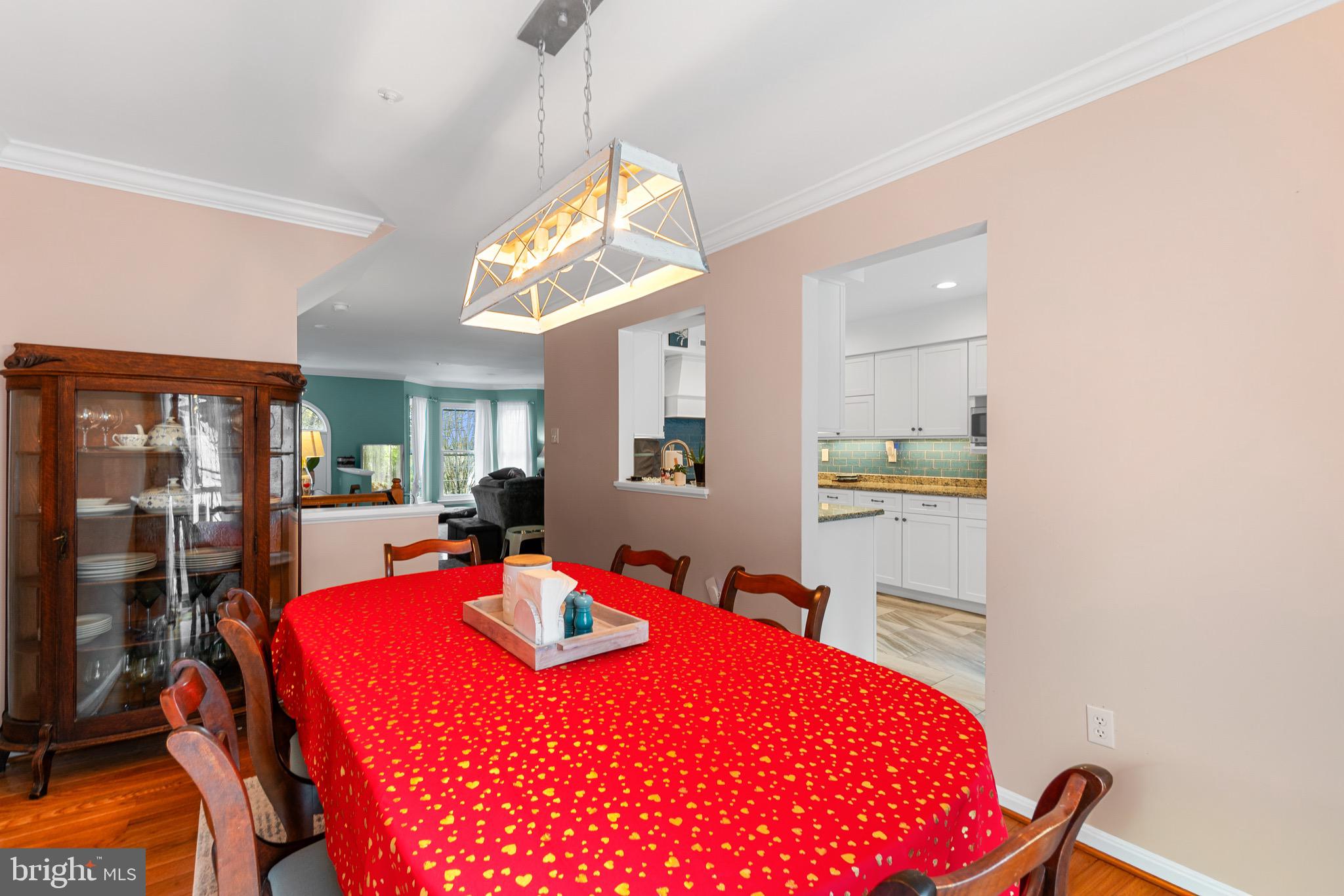 14010 Valleyfield Drive Silver Spring, MD 20906 - Photo 10 of 24 a bedroom with a bed and a chandelier