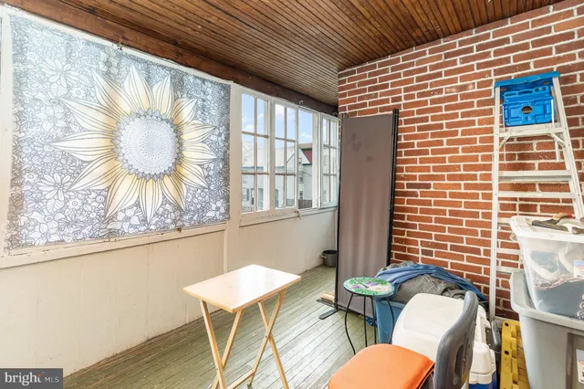 a view of a room with furniture and a potted plant