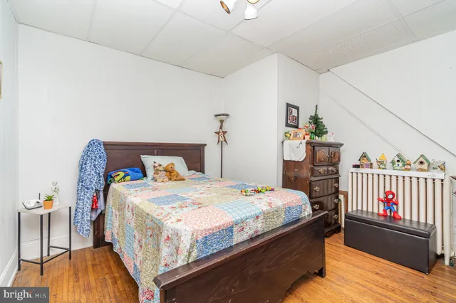 a bedroom with a bed and a table