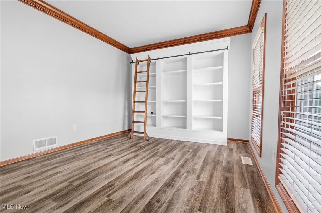 5700 Birmingham Road Northeast Canton, OH 44721 - Photo 7 of 37 Living room or office w/LVT flooring and built-ins