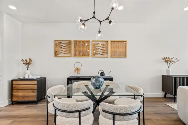 a view of a room with furniture and wooden floor