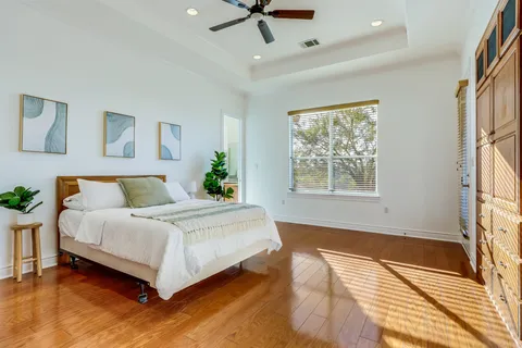 a spacious bedroom with a bed and a window