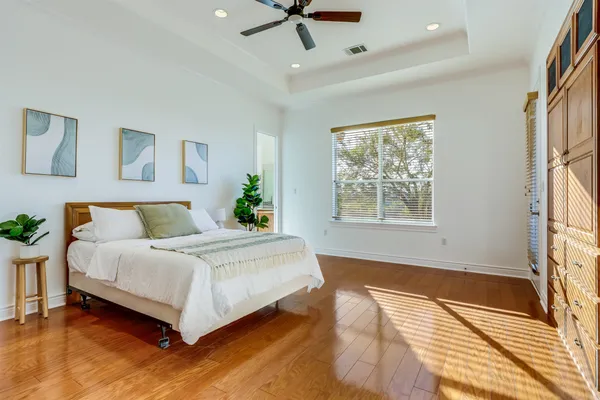 a bedroom with a bed and a fireplace