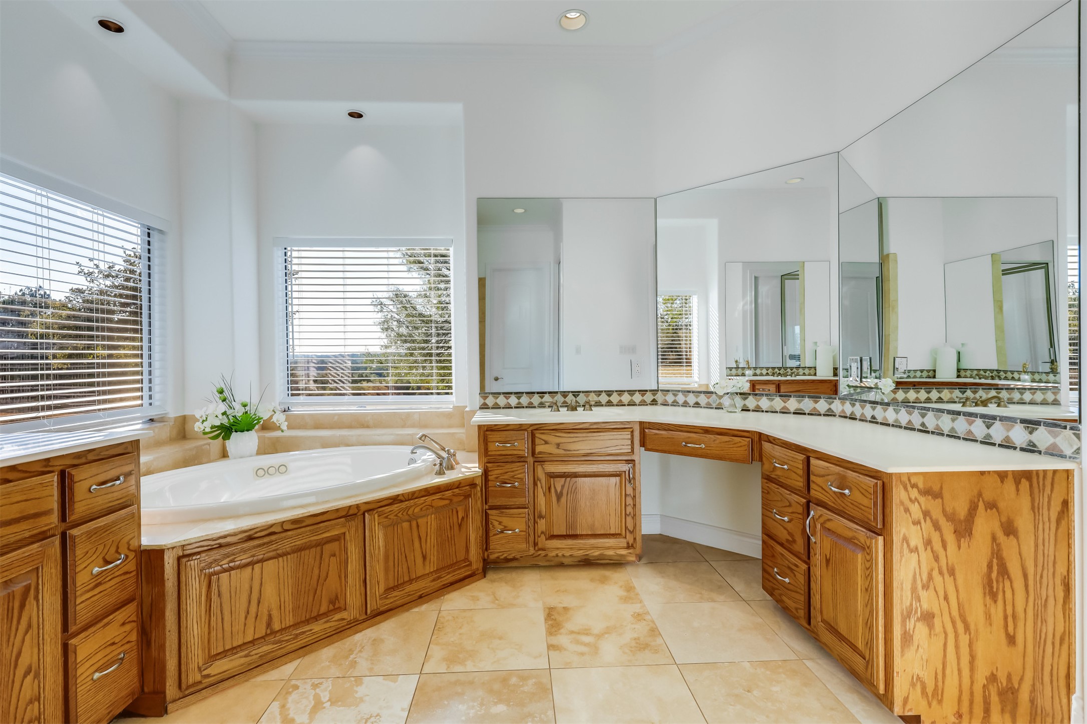 104 Running Brook Trail Spicewood, TX 78669 - Photo 18 of 40 a bathroom with a granite countertop sink and a bathtub