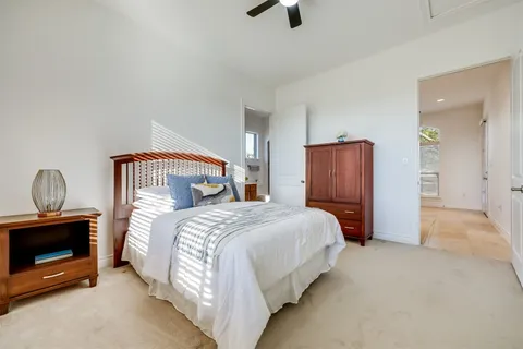 a bedroom with a bed and a fireplace