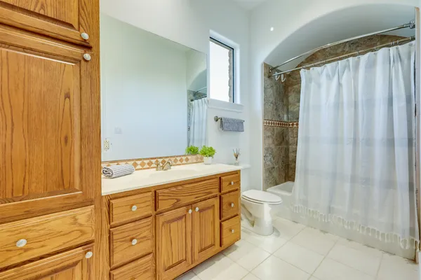 a utility room with stainless steel appliances washer and dryer