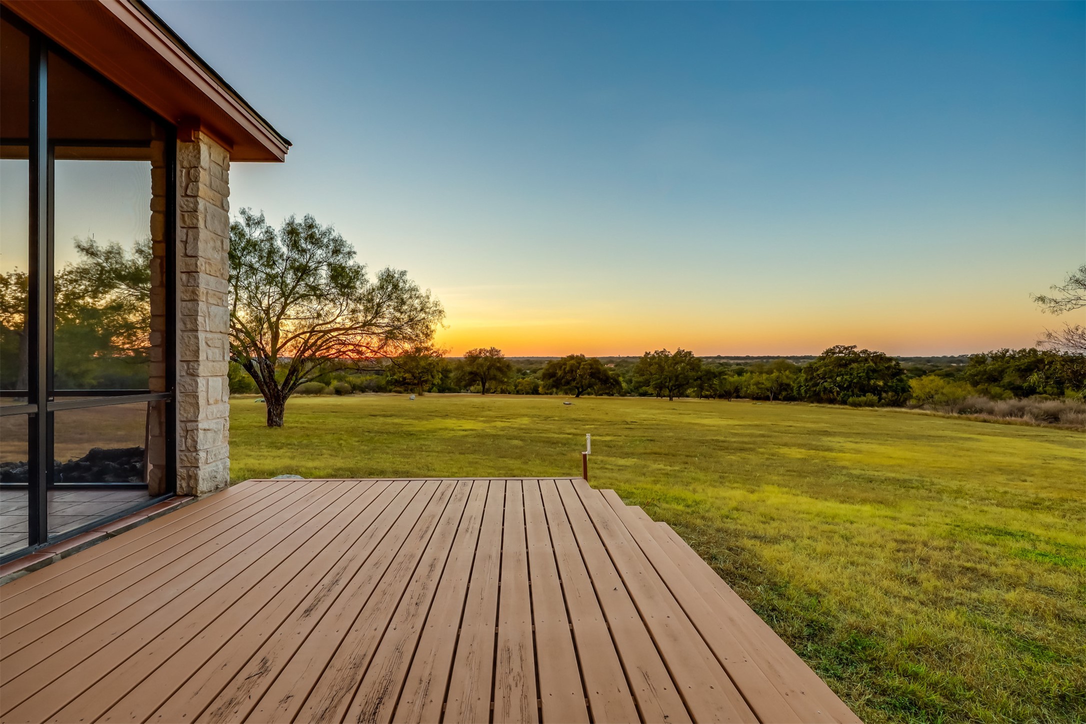 104 Running Brook Trail Spicewood, TX 78669 - Photo 30 of 40 Deck at dusk, the most incredible and peaceful views