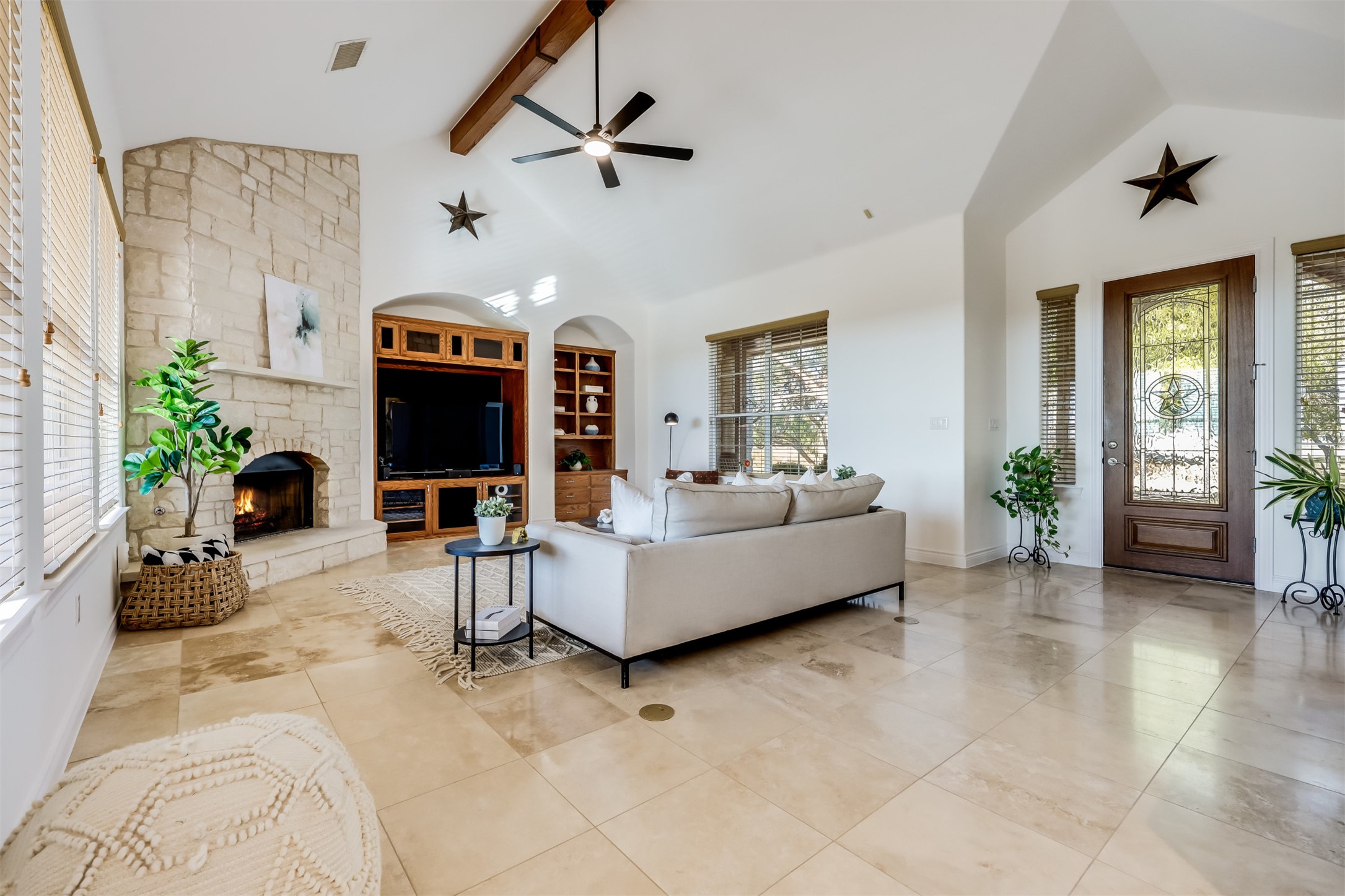 104 Running Brook Trail Spicewood, TX 78669 - Photo 6 of 40 a living room with furniture and a flat screen tv