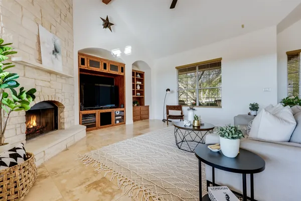 a kitchen with stainless steel appliances granite countertop a stove a sink dishwasher a refrigerator and cabinets with wooden floor