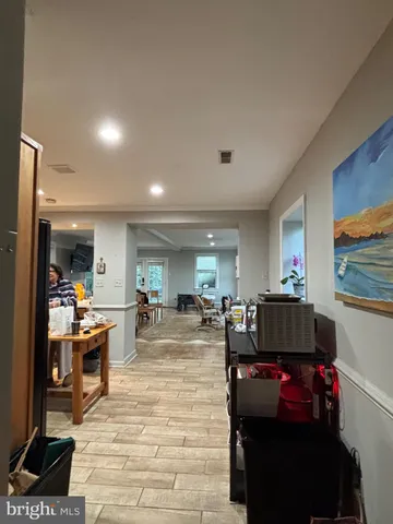 a room with lots of furniture and a flat screen tv