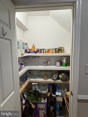 a shelf with cup and plates