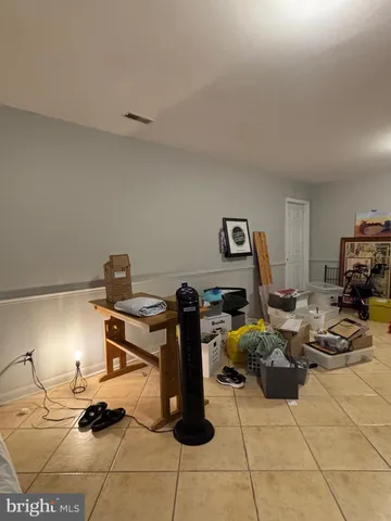 a room with gym equipment and a table