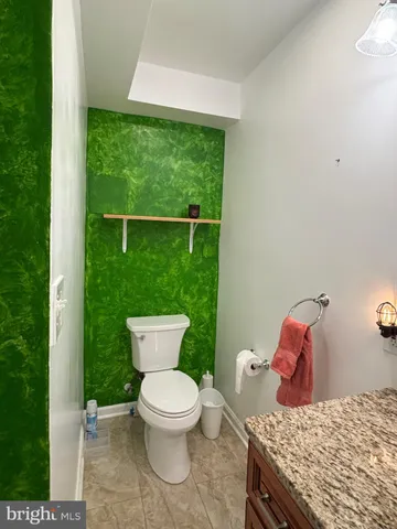 a bathroom with a toilet and a sink