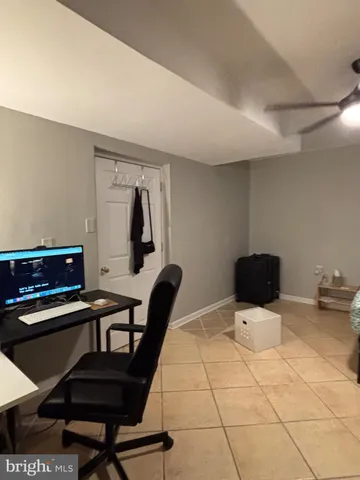 a work room with furniture and wooden floor