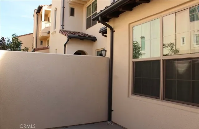 a bathroom with a granite countertop sink and mirror