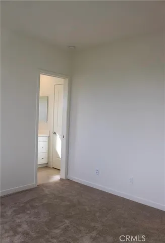 a bathroom with a glass door shower a sink and a mirror