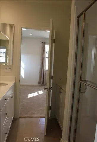 a bathroom with a toilet a sink and shower