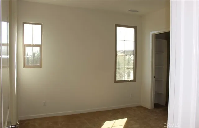 an empty room with windows
