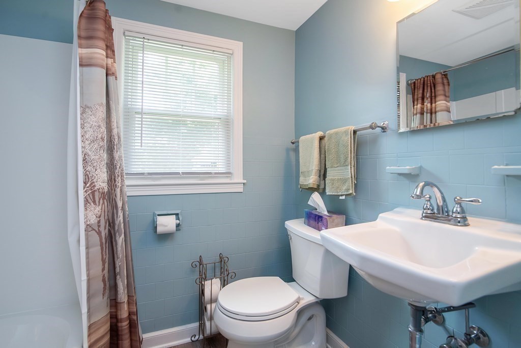 5 Clough Street Springfield, MA 01118 - Photo 17 of 26 a bathroom with a sink toilet and a mirror