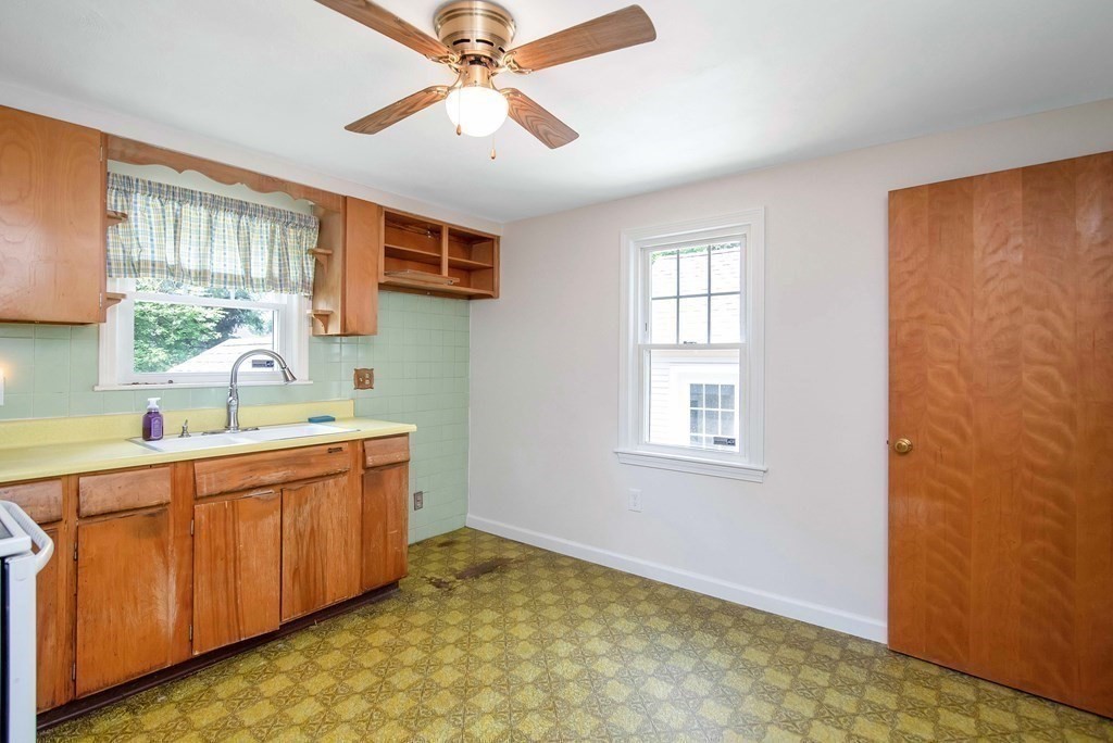 5 Clough Street Springfield, MA 01118 - Photo 4 of 26 a view of a kitchen with a sink and windows