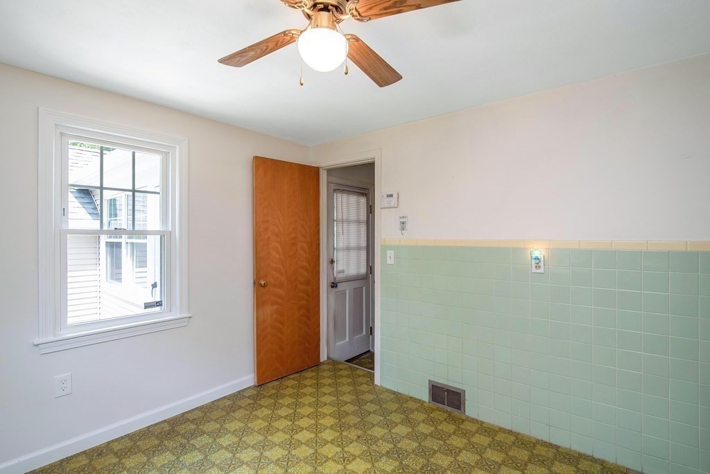 5 Clough Street Springfield, MA 01118 - Photo 5 of 26 a view of empty room with window and ceiling fan