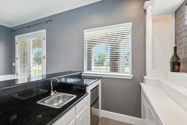 a room with furniture pool table and flat screen tv