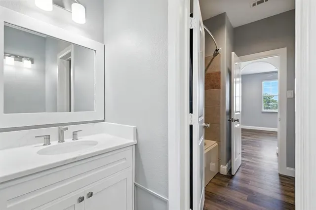 a bathroom with a sink and a mirror