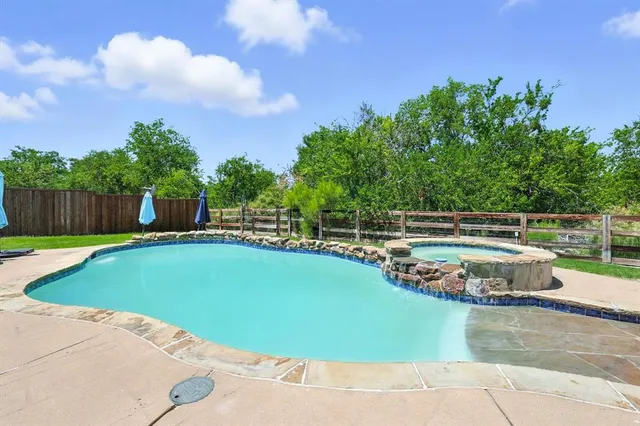 a view of a swimming pool and outdoor space