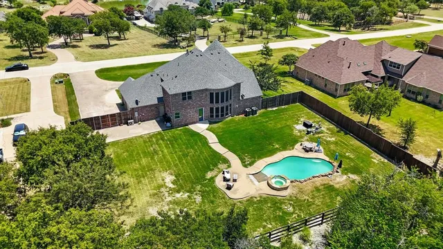a backyard of a house with outdoor seating and green space
