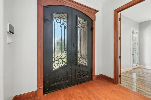 a view of an entryway with a hallway