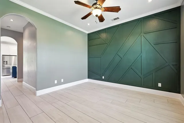 a kitchen with stainless steel appliances granite countertop a refrigerator a sink and a stove