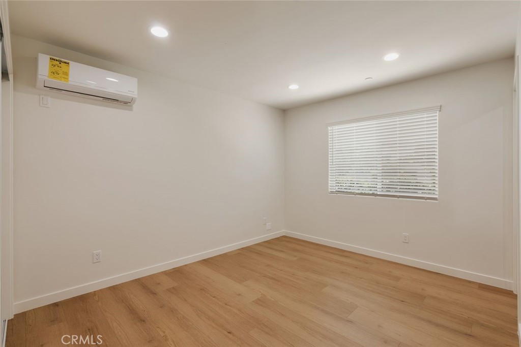 1806 South 8th Street, Unit B Alhambra, CA 91803 - Photo 27 of 44 an empty room with wooden floor and windows