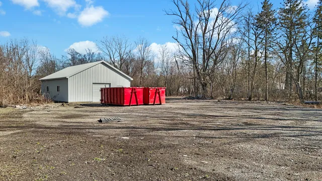 a backyard of a house with trees and outdoor space