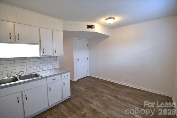 a kitchen with a sink and cabinets