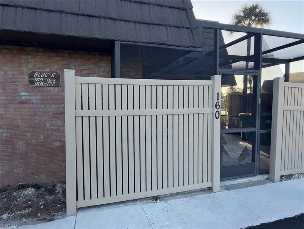 160 Lake Point Lane, Unit 6D Naples, FL 34112 - Photo 11 of 14 a view of a porch of a house