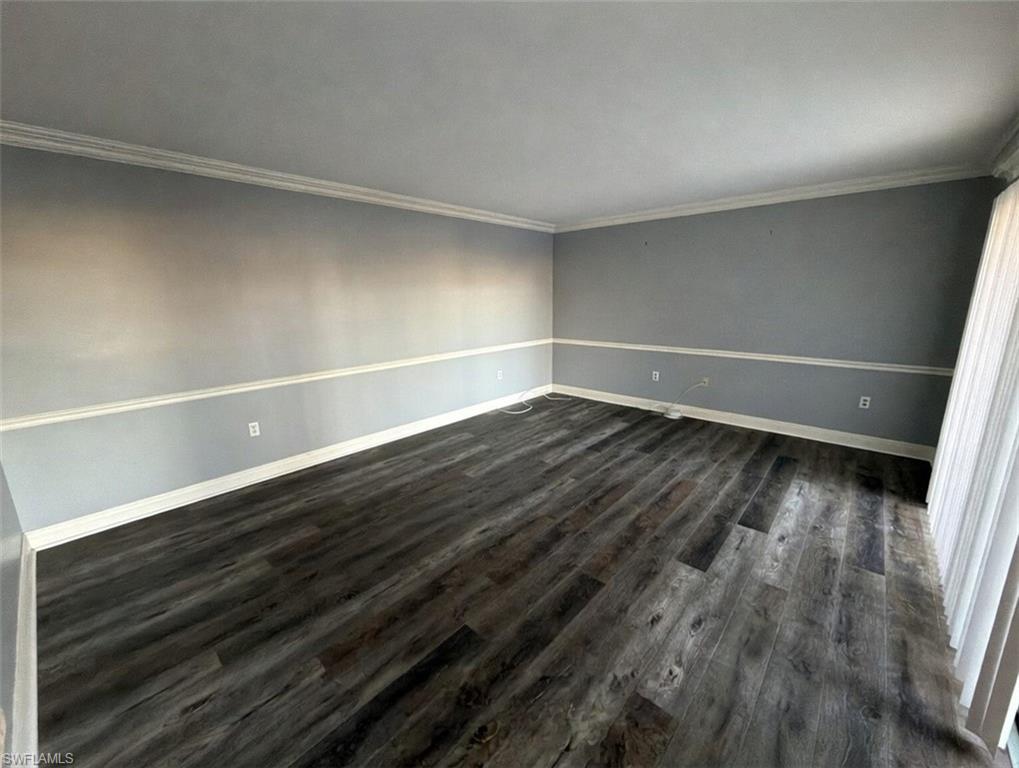 160 Lake Point Lane, Unit 6D Naples, FL 34112 - Photo 2 of 14 a view of an empty room with wooden floor