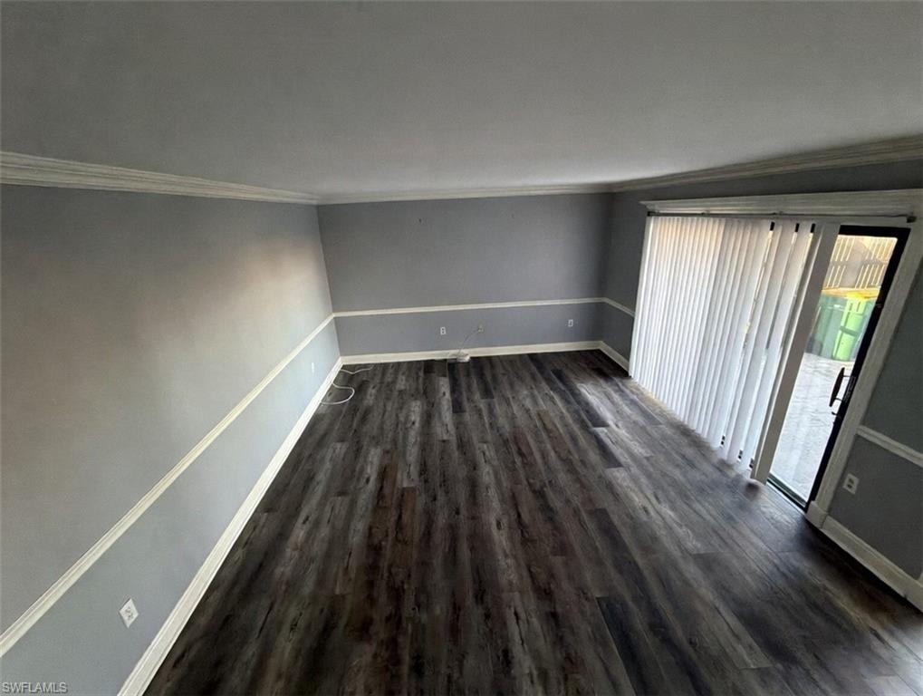 160 Lake Point Lane, Unit 6D Naples, FL 34112 - Photo 3 of 14 a view of a room with wooden floor and a window