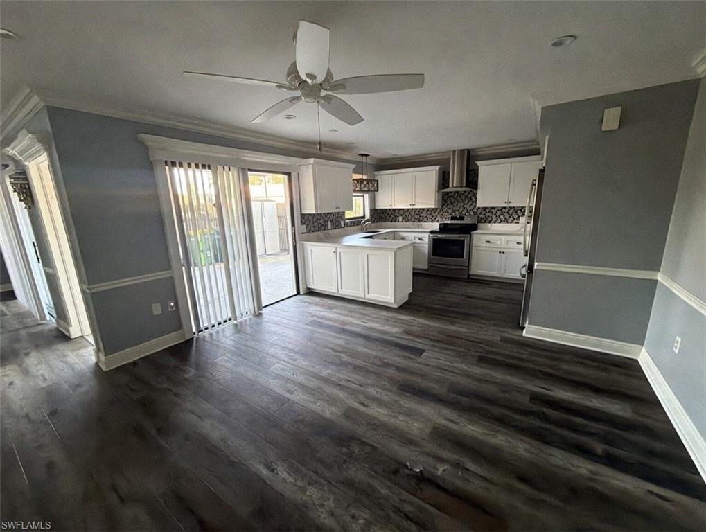 160 Lake Point Lane, Unit 6D Naples, FL 34112 - Photo 4 of 14 a kitchen with a refrigerator and white cabinets