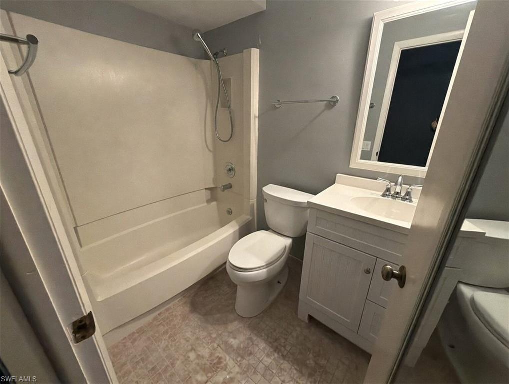 160 Lake Point Lane, Unit 6D Naples, FL 34112 - Photo 10 of 14 a bathroom with a sink a toilet and shower