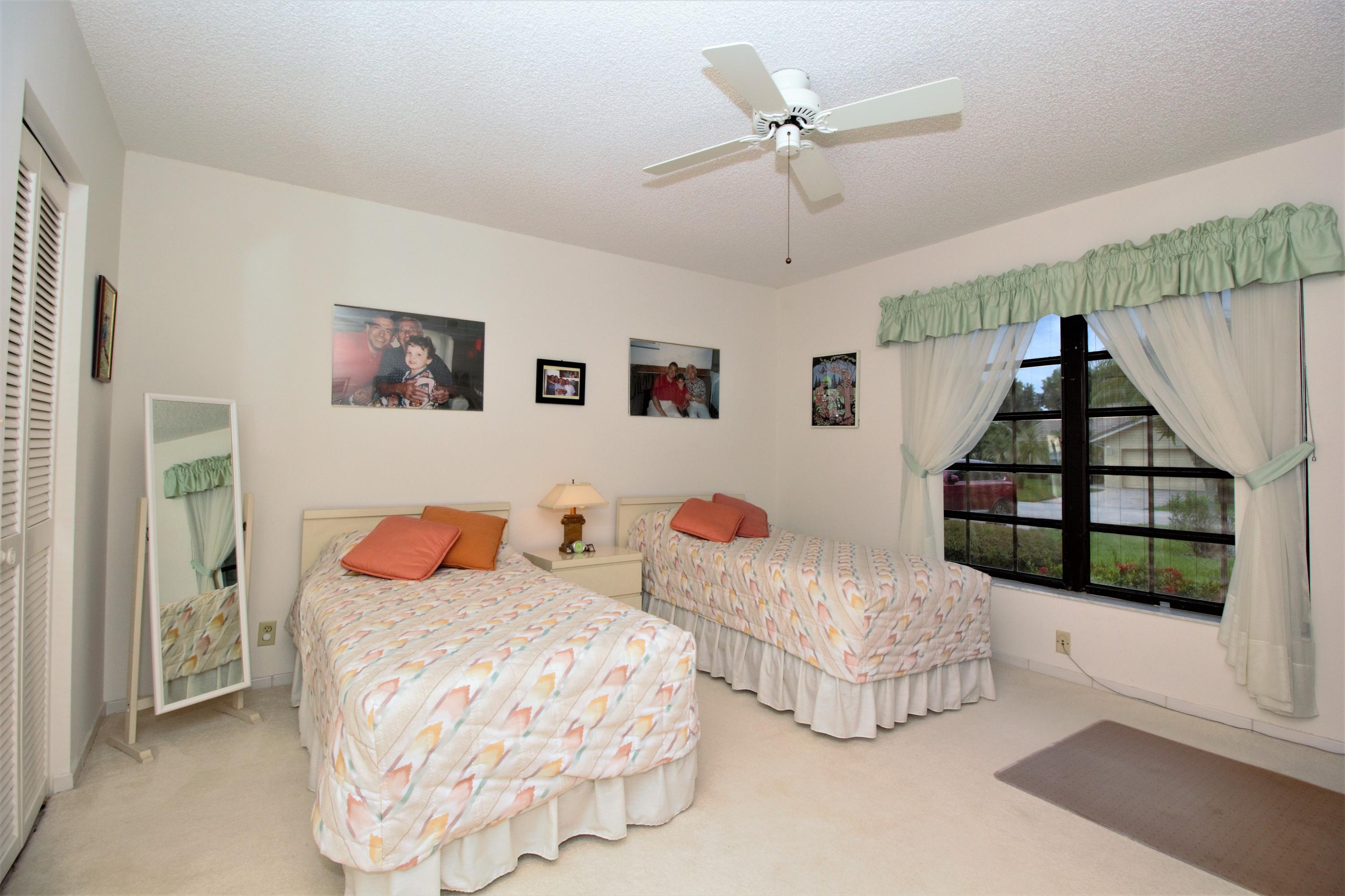 7751 Cloverfield Circle Boca Raton, FL 33433 - Photo 17 of 26 a bedroom with bed and a window
