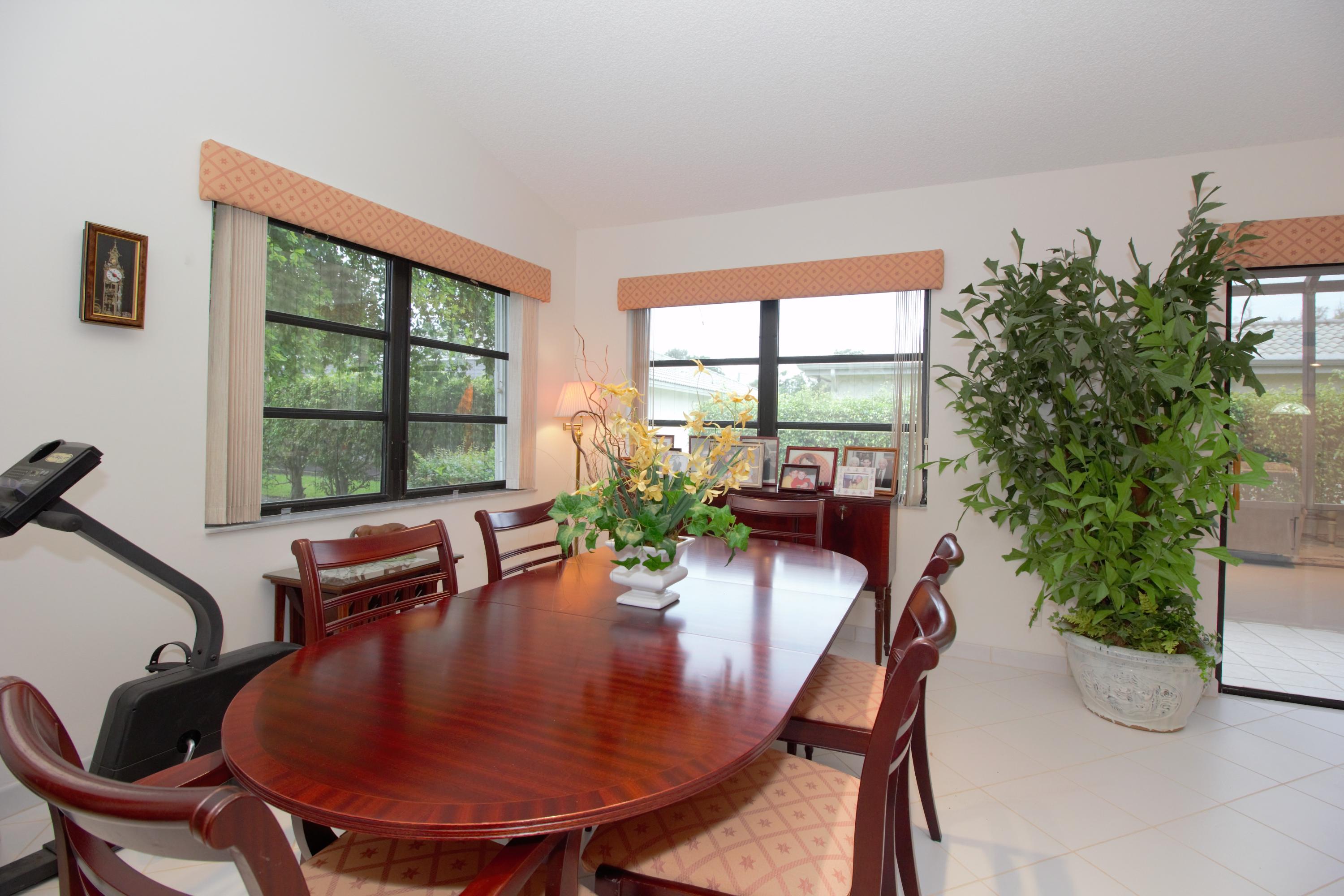 7751 Cloverfield Circle Boca Raton, FL 33433 - Photo 9 of 26 a dining room with furniture window and outside view