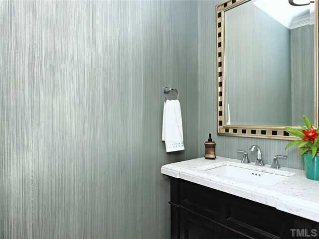 2305 Finley Ridge Lane Raleigh, NC 27615 - Photo 14 of 25 a bathroom with a granite countertop sink and a mirror