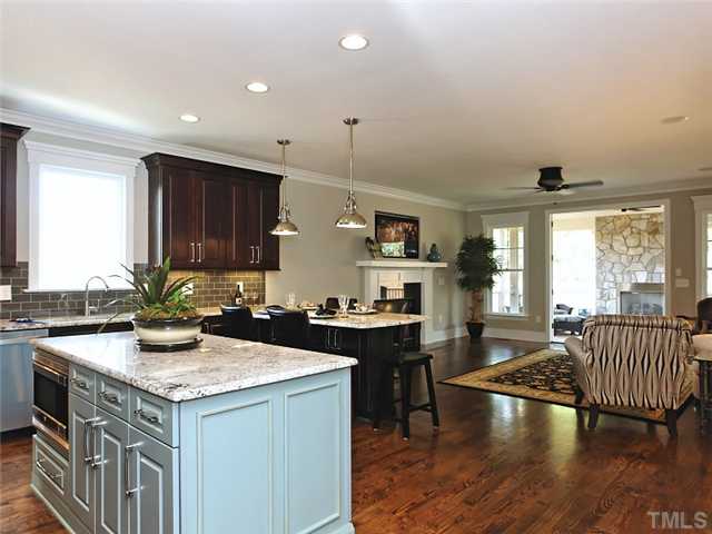 2305 Finley Ridge Lane Raleigh, NC 27615 - Photo 4 of 25 a kitchen with a stove a sink and a refrigerator