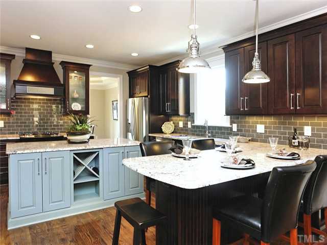 2305 Finley Ridge Lane Raleigh, NC 27615 - Photo 6 of 25 a kitchen with a sink appliances and cabinets