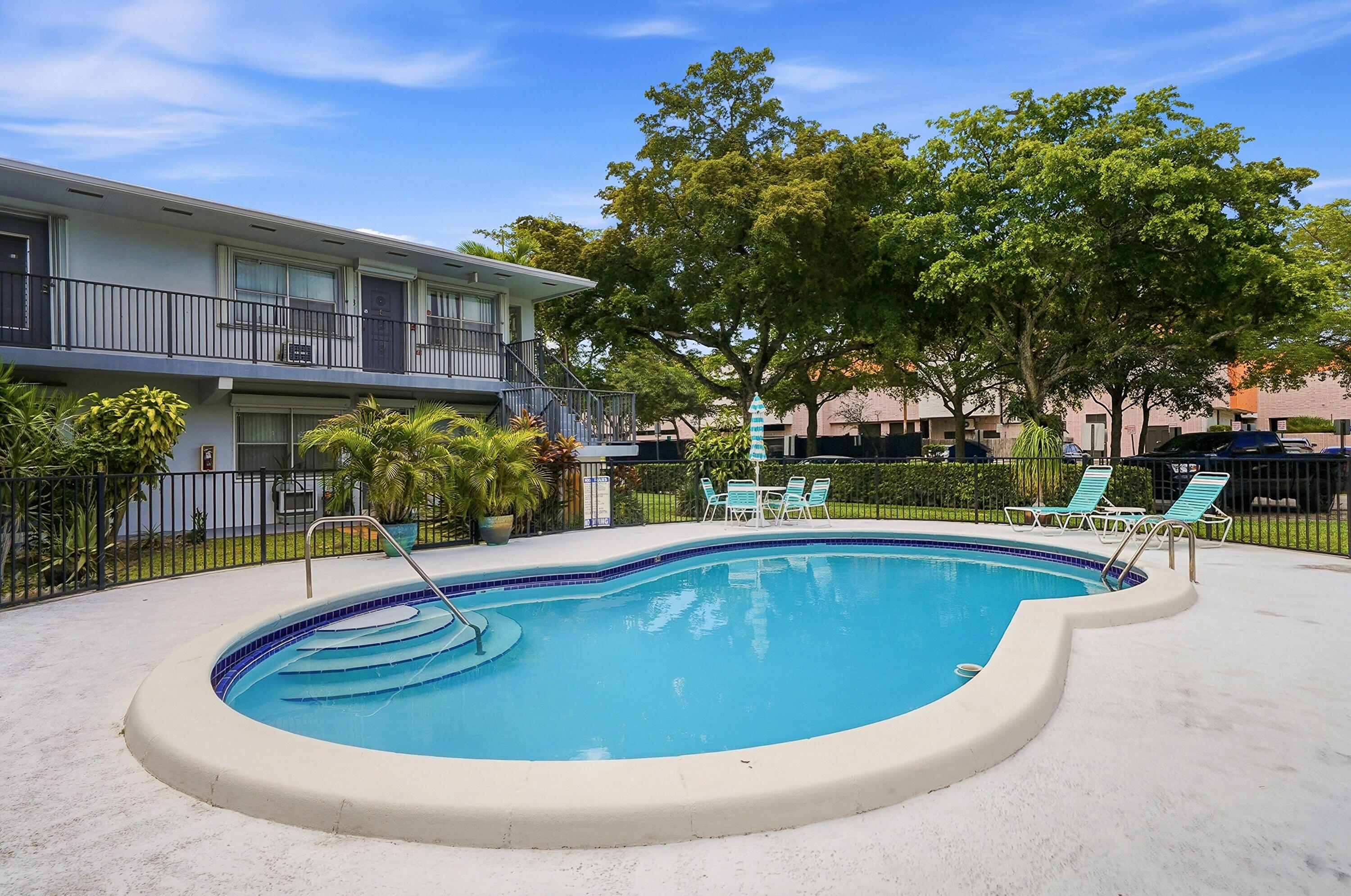 3510 Harrison Street, Unit 4 Hollywood, FL 33021 - Photo 22 of 31 a view of a swimming pool with a patio